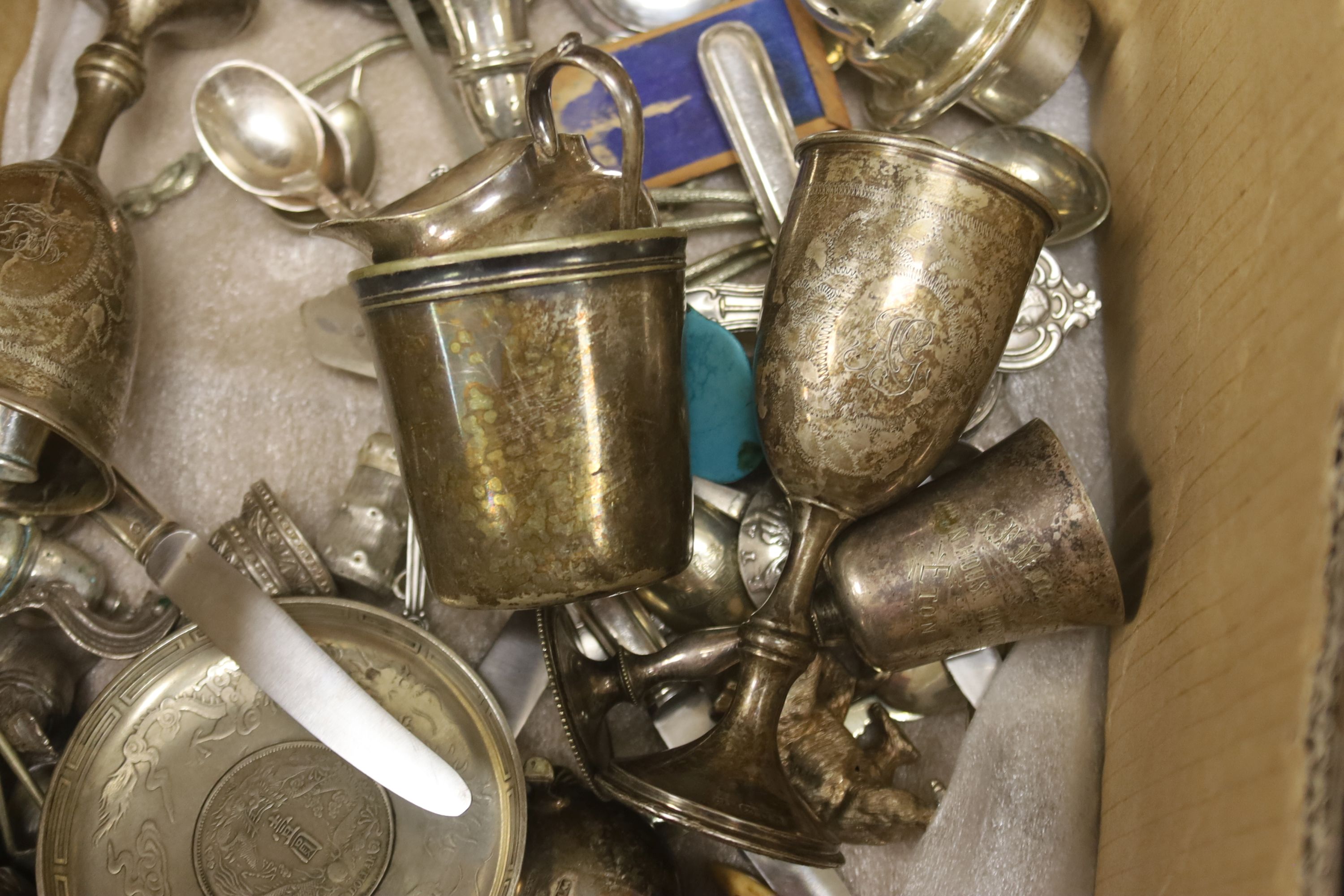 A quantity of plated tableware and cutlery